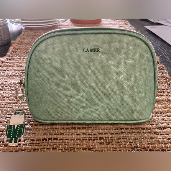 La Mer Handbags - La Mer bundle makeup bag and keychain/ bag charm